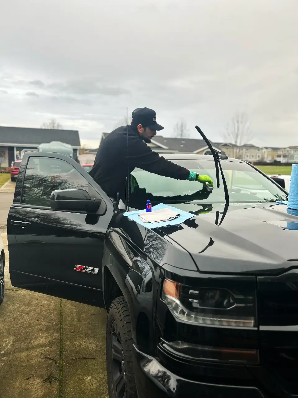 Chano, founder of Mobile Solutionz, detailing a vehicle